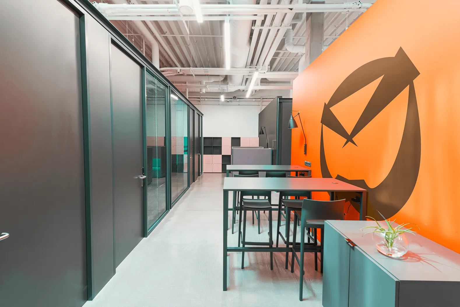 Boltmail office corridor with the envelope symbol painted large on an orange wall
